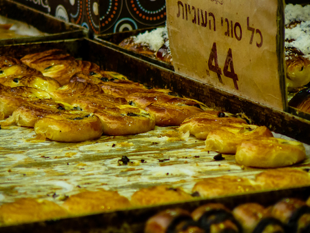 Jerusalem Israel May 24, 2018 Closeup of various pastries sold in the market of Jerusalem in Israel in the eveningのeditorial素材