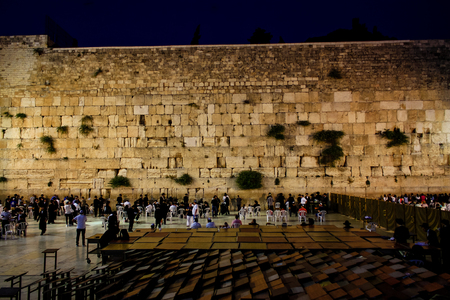 Jerusalem Israel May 17, 2018 Unknowns people praying front the Western Wall in the Old city of Jerusalem in the eveningのeditorial素材