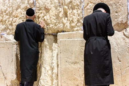 Jerusalem Israel May 21, 2018 View of unknowns religious Orthodox Jews praying in front of the western wall of the old city of Jerusalem in the eveningのeditorial素材