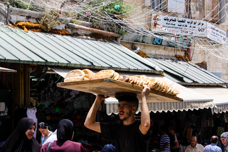 Jerusalem Israel May 28, 2018 View of unknowns people walking in David street in the muslim quarter at the Old city of Jerusalem in the morningのeditorial素材