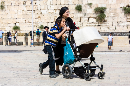 Jerusalem Israel May 21, 2018 View of unknowns people walking on the Western wall plaza in the old city of Jerusalem in the eveningのeditorial素材