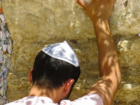 Jerusalem Israel May 21, 2018 View of unknowns people praying front the Western wall in the old city of Jerusalem in the eveningの写真素材