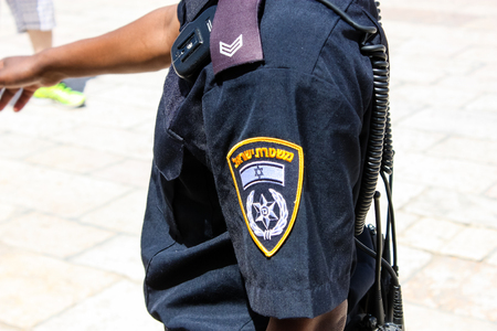Jerusalem Israel May 21, 2018 View of unknown Israeli police officer walking on the Western wall plaza in the old city of Jerusalemのeditorial素材