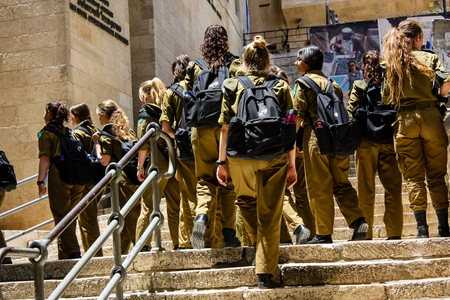 Jerusalem Israel May 21, 2018 View of Israeli soldiers walking in the street of the old city of Jerusalem in the Jewish quarter in the eveningのeditorial素材