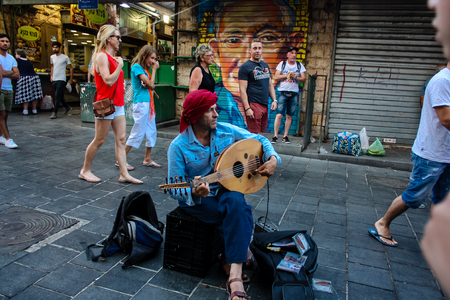 Jerusalem Israel May 24, 2018 View of a street musician singing at the entrance of Mahane Yehuda...