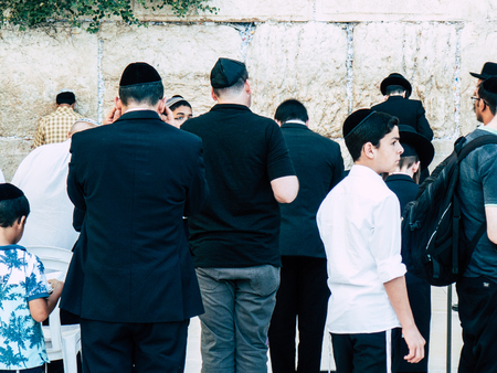Jerusalem Israel April 14, 2018 Unknowns people praying front the Western Wall at the old city of Jerusalem on afternoonのeditorial素材