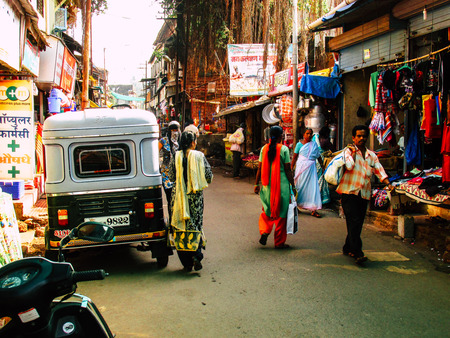 Ratnagiri Maharashtra India December 23, 2017 View of shops and unknowns people walking in the main street of Ratnagiri in the afternoonのeditorial素材