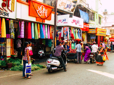 Ratnagiri Maharashtra India December 23, 2017 View of shops and unknowns people walking in the main street of Ratnagiri in the afternoonのeditorial素材