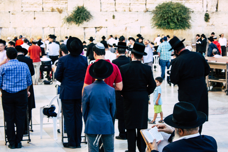 Jerusalem Israel June 22, 2018 View of unknowns people praying front the Western Wall at the old city of Jerusalem in the eveningのeditorial素材