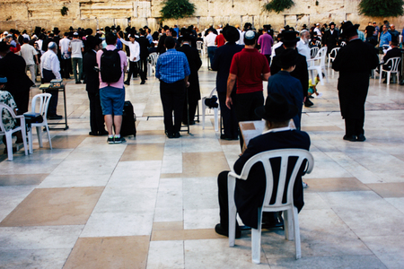 Jerusalem Israel June 22, 2018 View of unknowns people praying front the Western Wall at the old city of Jerusalem in the eveningのeditorial素材