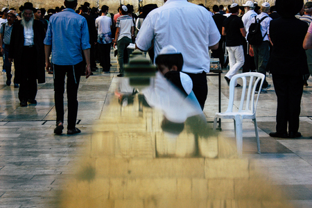 Jerusalem Israel June 22, 2018 View of unknowns people praying front the Western Wall at the old city of Jerusalem in the eveningのeditorial素材