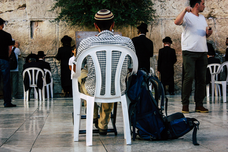 Jerusalem Israel June 22, 2018 View of unknowns people praying front the Western Wall at the old city of Jerusalem in the eveningのeditorial素材