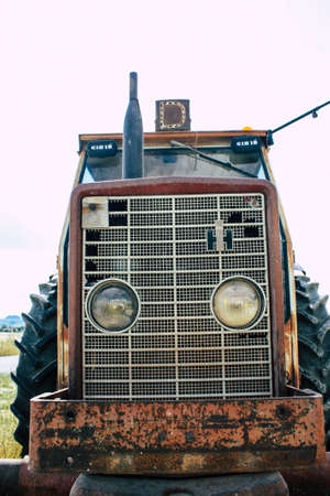 Bezannes France july 07, 2018 View of a tractor working in the field in Champagne area in the...