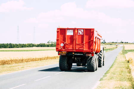 Bezannes France july 07, 2018 View of a tractor working in the field in Champagne area in the...