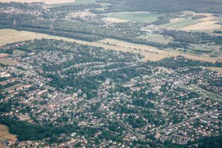 Aerial view of buildings near Paris in France at 10,000 feet altitude in the afternoon