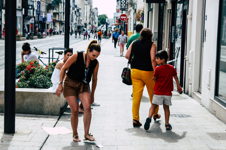 Reims France July 23, 2018 View of unknowns people walking in the street of Reims in the afternoonのeditorial素材