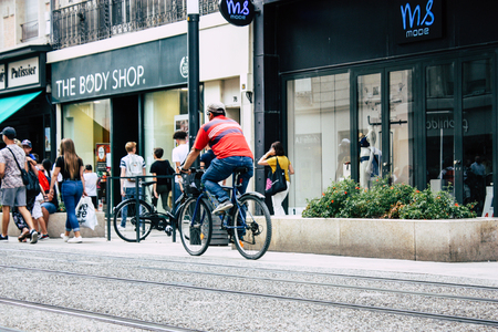 Reims France July 23, 2018 View of unknown people on bicycle in the street of Reims in the afternoonのeditorial素材