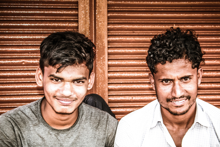 Gokarna Karnataka India November 01, 2017 Portrait of unknown people selling flowers in the street of Gokarna town in the eveningのeditorial素材