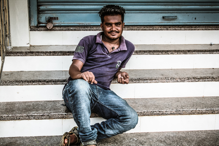 Gokarna Karnataka India November 01, 2017 Portrait of unknown people selling flowers in the street of Gokarna town in the eveningのeditorial素材