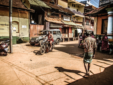 Gokarna Karnataka India October 30, 2017 View of unknown people walking in the main street of Gokarna town in the morningのeditorial素材