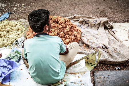 Gokarna Karnataka India November 01, 2017 Portrait of unknown people selling flowers in the street of Gokarna town in the eveningのeditorial素材