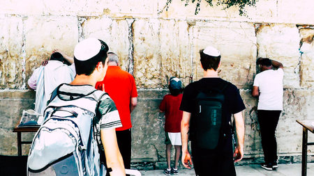 Jerusalem Israel June 18, 2018 View of unknowns people praying front the Western Wall at the old city of Jerusalem in the morningのeditorial素材