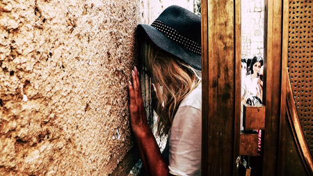 Jerusalem Israel June 18, 2018 View of unknowns woman praying front the Western Wall at the old city of Jerusalem in the morningのeditorial素材
