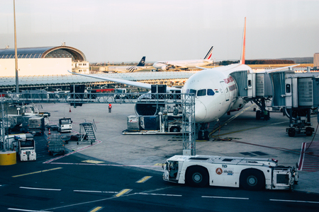 Paris France August 19, 2018 View of a plane at the terminal of the terminal 2C of the Charles de Gaulle International airport in the eveningのeditorial素材