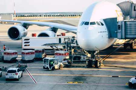Paris France August 19, 2018 View of a plane at the terminal of the terminal 2C of the Charles de Gaulle International airport in the eveningのeditorial素材