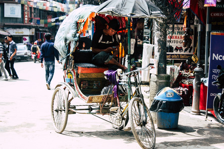 Kathmandu Nepal August 21, 2018 View of unknown Nepali people driving a touk touk in Thamel street in Kathmandu in the morningのeditorial素材