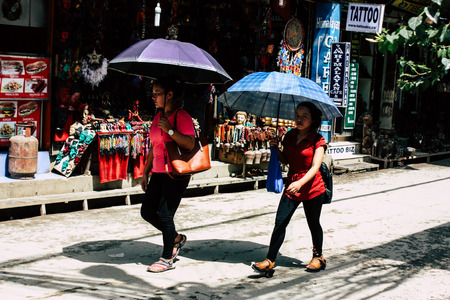 Kathmandu Nepal August 21, 2018 View of unknown people walking with a umbrella in Thamel street in Kathmandu in the morningのeditorial素材