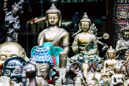 Closeup of decorative statues of Buddha sold in a souvenirs shop at Thamel street in Kathmanduの写真素材