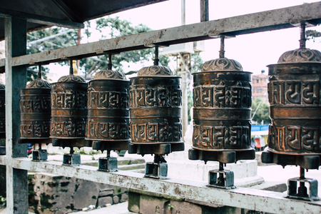 Kathmandu Nepal August 23, 2018 View of Tibetan prayer wheels at the Monkey temple in Swayambhunath area in Kathmandu in the eveningのeditorial素材