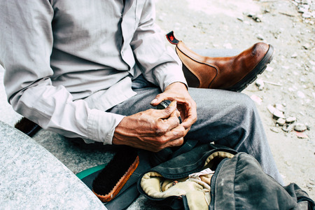 Kathmandu Nepal August 22, 2018 Closeup of a Nepali shoe polisher working  at Thamel street in Kathmandu in the morningのeditorial素材
