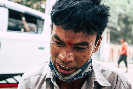 Kathmandu Nepal August 22, 2018 Closeup of a Nepali shoe polisher working  at Thamel street in Kathmandu in the morningのeditorial素材