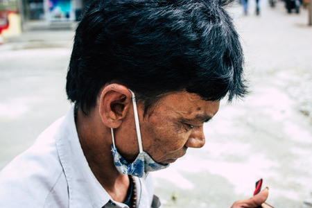 Kathmandu Nepal August 22, 2018 Closeup of a Nepali shoe polisher working  at Thamel street in Kathmandu in the morningのeditorial素材