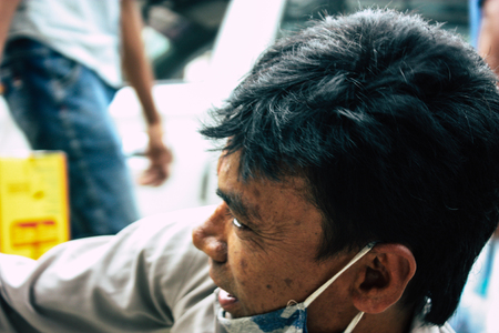 Kathmandu Nepal August 22, 2018 Closeup of a Nepali shoe polisher working  at Thamel street in Kathmandu in the morningのeditorial素材