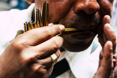 Kathmandu Nepal August 22, 2018 Closeup of a unknown people playing with a traditional Nepalese music instrument at Thamel street in Kathmandu in the morningのeditorial素材