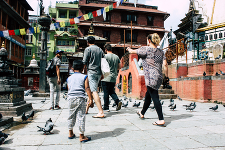 Kathmandu Nepal August 24, 2018 View of a Nepali child playing around the Shree Gha Stupa Temple located in Naghal district between Thamel and Durbar square in Kathmandu in the morningのeditorial素材