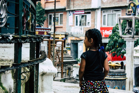 Kathmandu Nepal August 24, 2018 View of a Nepali child playing around the Shree Gha Stupa Temple located in Naghal district between Thamel and Durbar square in Kathmandu in the morningのeditorial素材