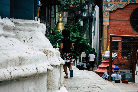 Kathmandu Nepal August 24, 2018 View of a Nepali child playing around the Shree Gha Stupa Temple located in Naghal district between Thamel and Durbar square in Kathmandu in the morningのeditorial素材