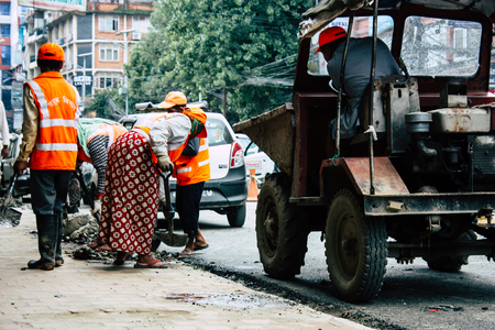 Kathmandu Nepal August 26, 2018 View of unknowns Nepali worker cleaning the street at Thamel district in Kathmandu in the afternoonのeditorial素材
