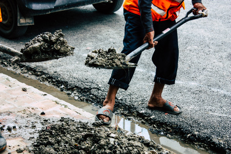 Kathmandu Nepal August 26, 2018 View of unknowns Nepali worker cleaning the street at Thamel...