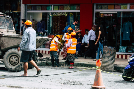 Kathmandu Nepal August 26, 2018 View of unknowns Nepali worker cleaning the street at Thamel...