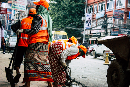 Kathmandu Nepal August 26, 2018 View of unknowns Nepali worker cleaning the street at Thamel district in Kathmandu in the afternoonのeditorial素材