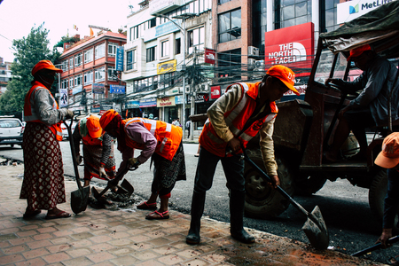 Kathmandu Nepal August 26, 2018 View of unknowns Nepali worker cleaning the street at Thamel district in Kathmandu in the afternoonのeditorial素材