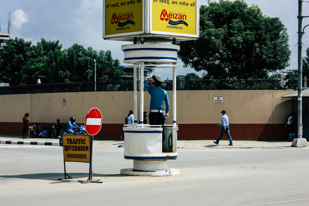 Kathmandu Nepal August 26, 2018 View of Nepali traffic police working in the middle of the street at Thamel district in Kathmandu in the afternoonのeditorial素材