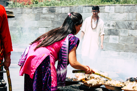 Kathmandu Nepal August 27, 2018 View of unknowns Hindu people making the fire ceremony inside the Pashupatinath temple in the morningのeditorial素材