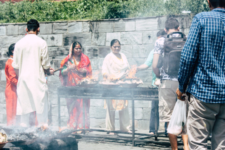 Kathmandu Nepal August 27, 2018 View of unknowns Hindu people making the fire ceremony inside the Pashupatinath temple in the morningのeditorial素材