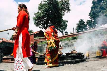 Kathmandu Nepal August 27, 2018 View of unknowns Hindu people making the fire ceremony inside the Pashupatinath temple in the morningのeditorial素材